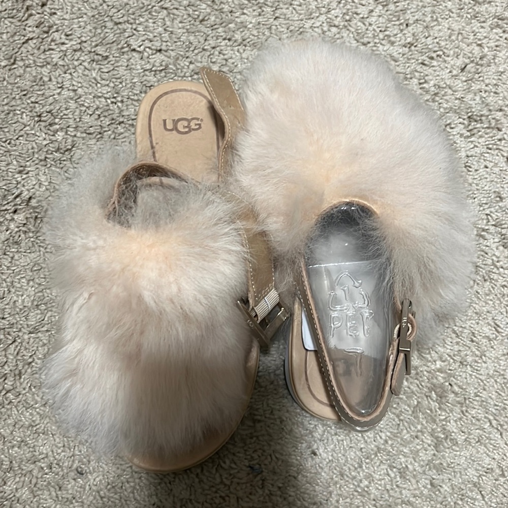 Brand new ugg fuzzy sandals!!  Never worn, super cute with jean shorts